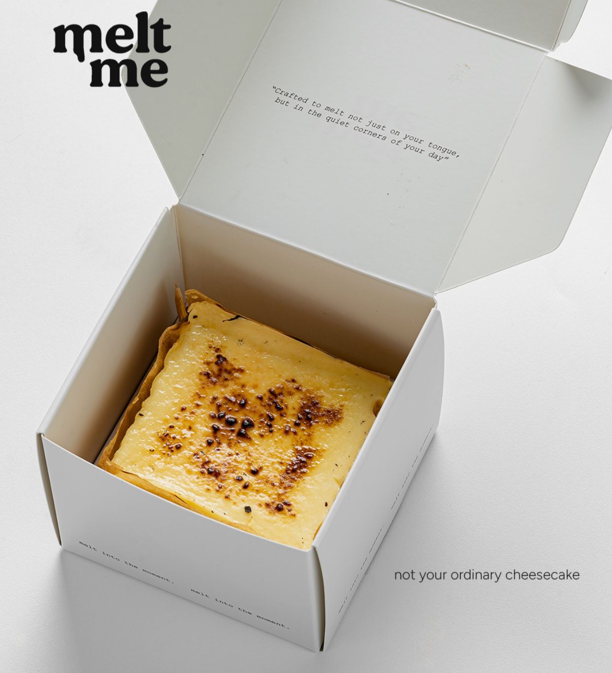 Melt Me OG Cheezmelt in branded white box — not your ordinary cheesecake