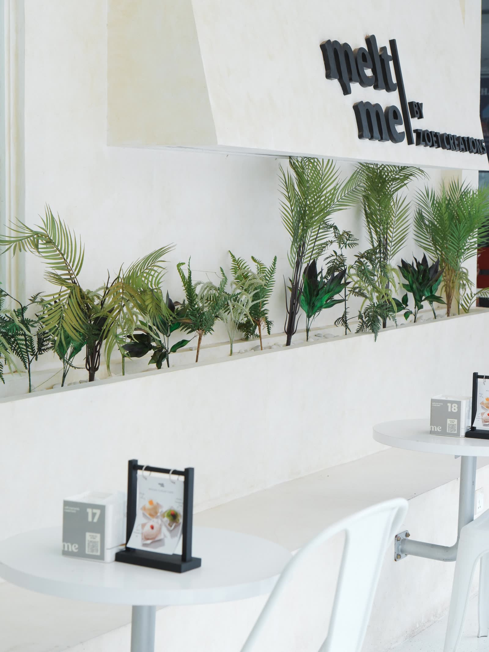 Melt Me by Zoet Creations 3D logo with tropical plant display